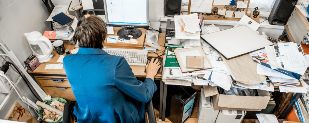 Business owner works in busy office