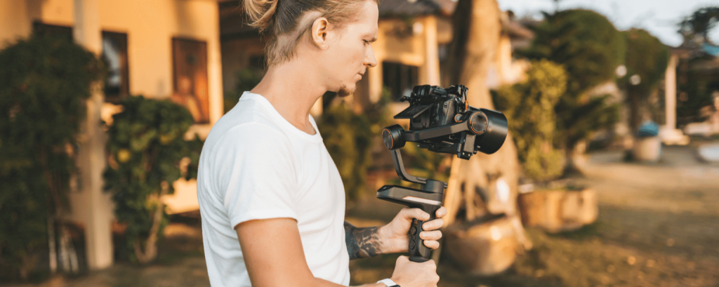 Videographer uses stabilizer