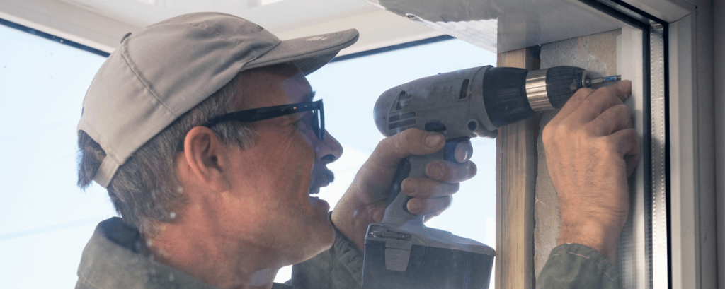 Contractor installs window frame