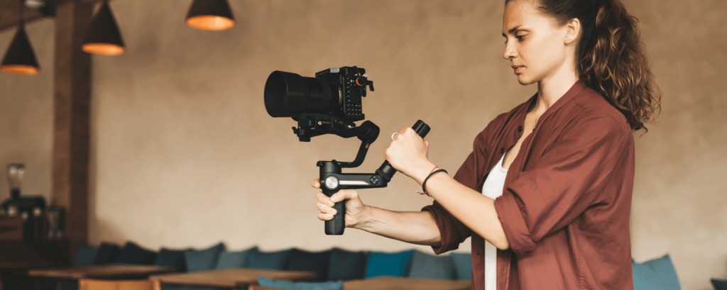 Videographer uses stabilizer