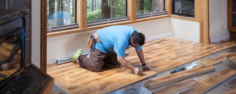 Flooring contractor working with hardwood