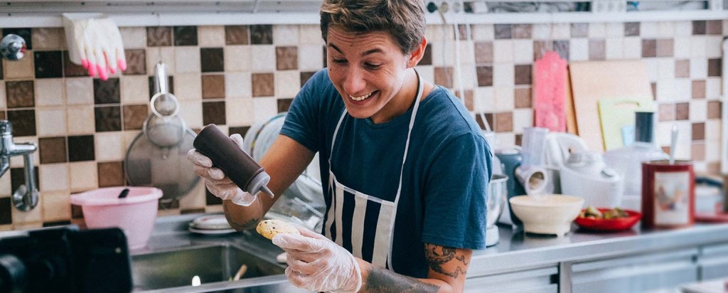 An insured home baker is baking cookies 


