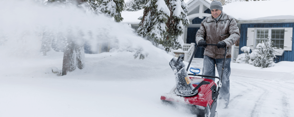 Man using a snowblower