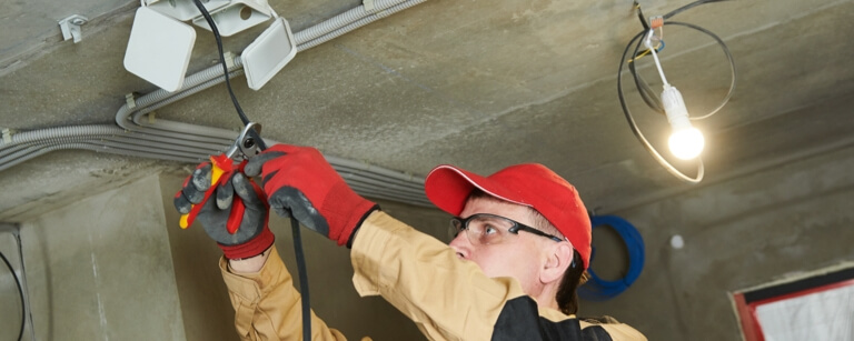 Cabler installing power cables