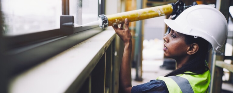 Commercial contractor using caulking gun