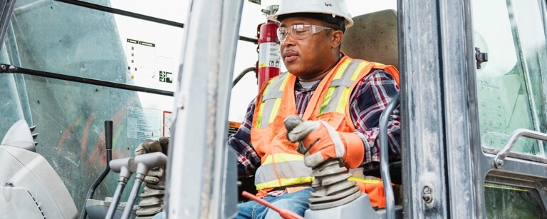 Male excavator pilots machinery