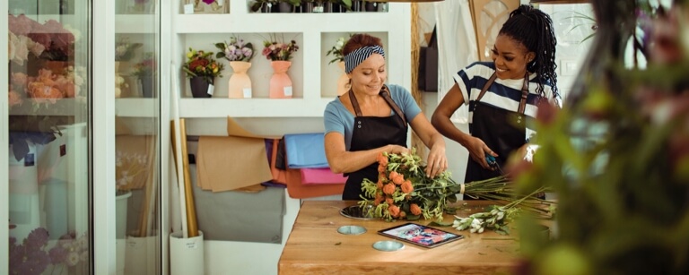 Two florists working together on a project