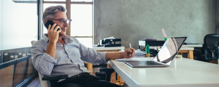 Freelancer works at laptop in shared office space