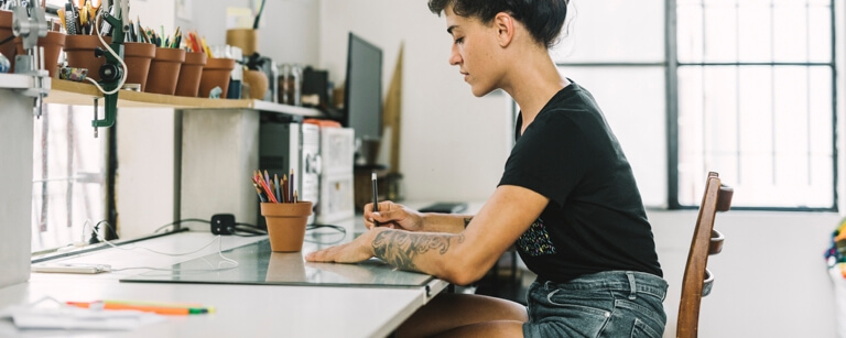 Female graphic designer working at desk