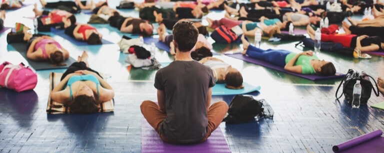 Pilates instructor with class