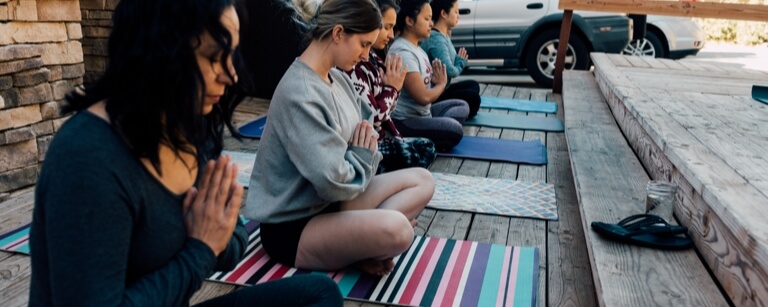 Pilates class taking place outdoors