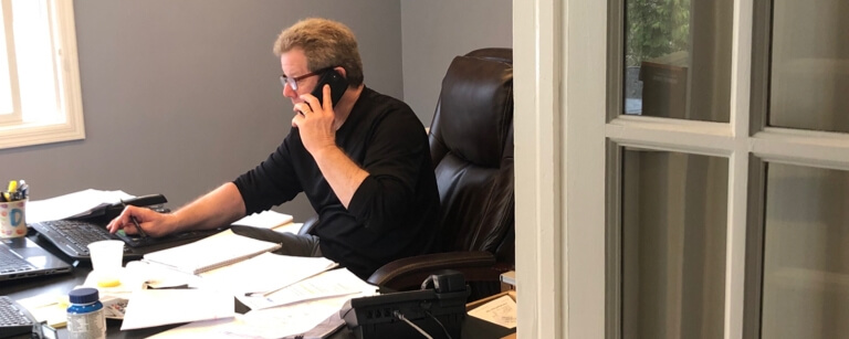 A process server on the phone