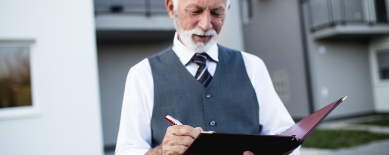 Property manager looking at a list