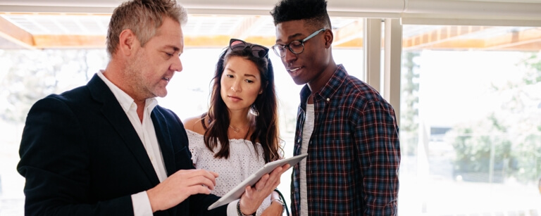 Real estate showing buyers round a house