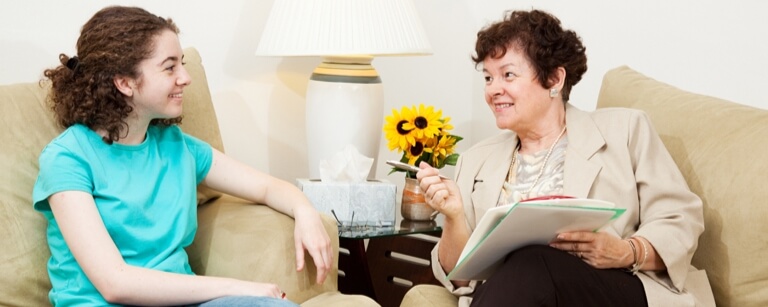 Social worker talking with client