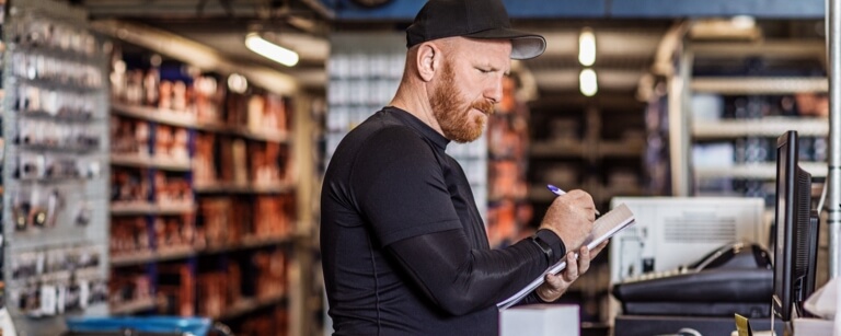 Retailer checks inventory at POS system