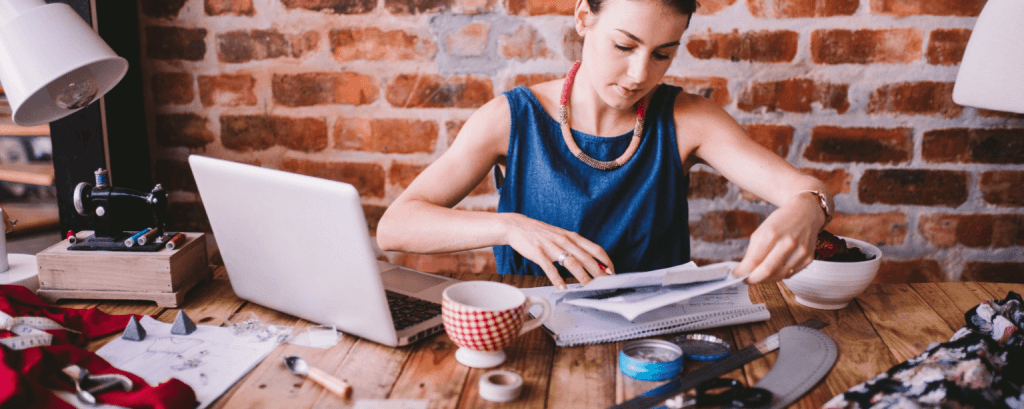 Small business owner works on laptop
