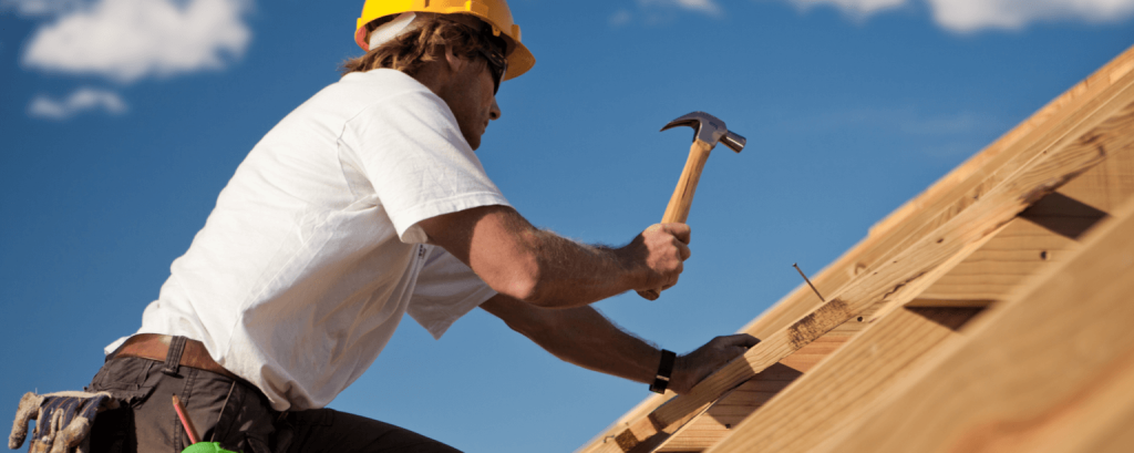Builder works on roof