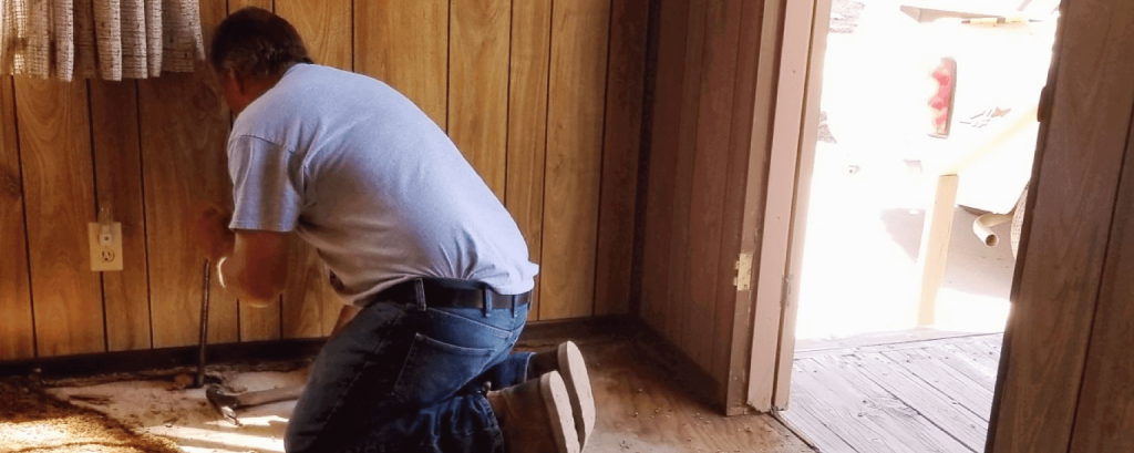 Contractor removes carpeting