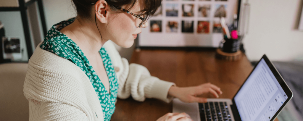 Business owner checks email on laptop