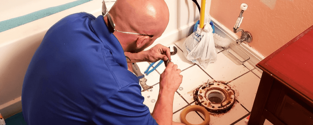 Plumber replaces toilet