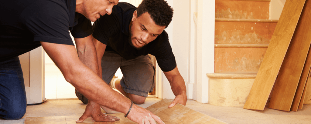 Contractors install flooring