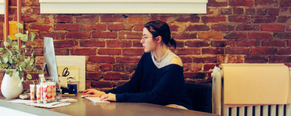Business owner works at laptop