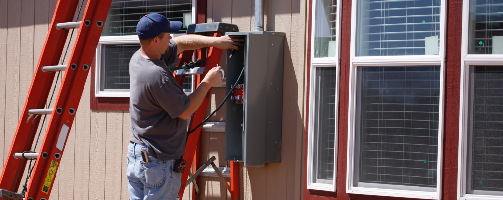 Electrician works outside home