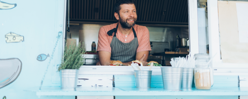 Food truck vendor with burgers