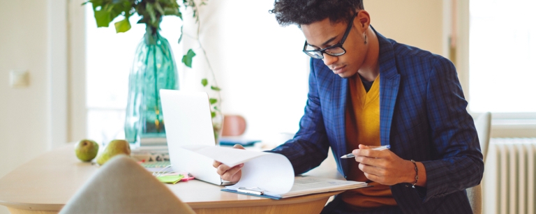 A tax professional with tax preparer insurance is working on forms

