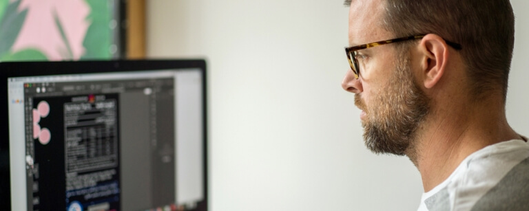 Web designer working with desktop computer