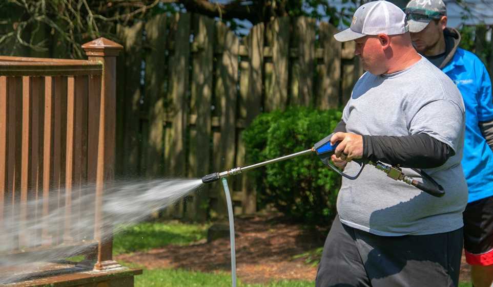 Once you learn how to start a pressure washing business, you can start working on projects, like this professional pressure washer.