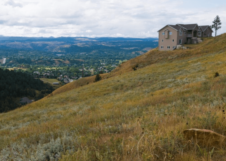 view of house on hill overlooking valley in South Dakota