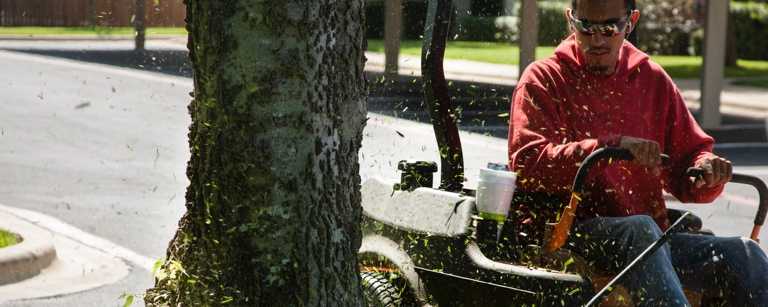 Lawn care worker on riding mower
