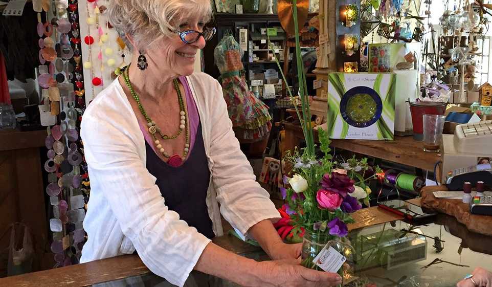 Give great gifts to your customers for a memorable shopping experience, just like this florist is doing.