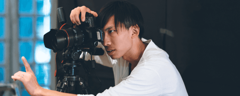 Photographer shoots model in his studio