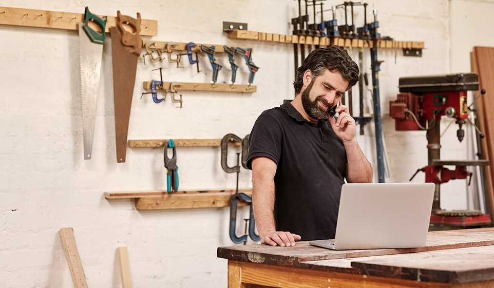 These self-employed tax tips can help you feel more confident about your taxes, like this contractor in his workshop.