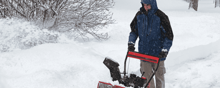 Another man using a snowblower