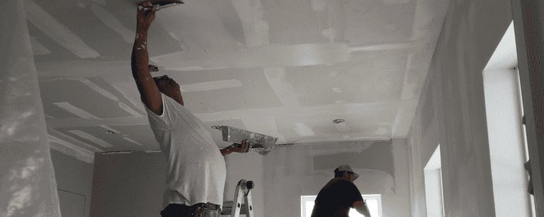 Contractors work on ceiling