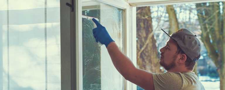 Window cleaner working on residential sliding door