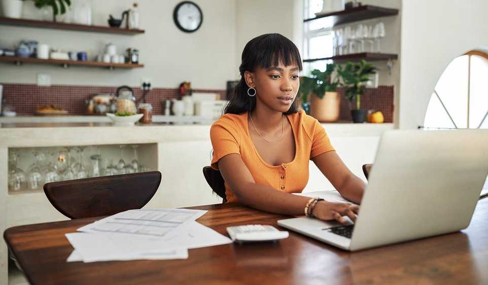 Invest your time and attention in doing your small business taxes, like this entrepreneur going through her online taxes.
