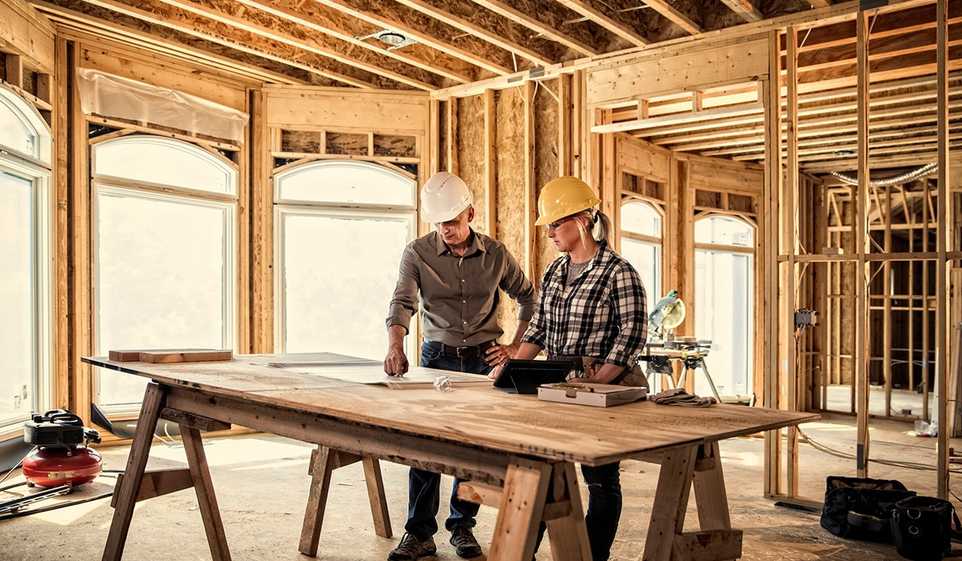 Protecting your construction business ensures you and your employees can focus on work, like these two contractors.