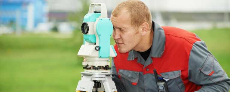 Land surveyor using tools