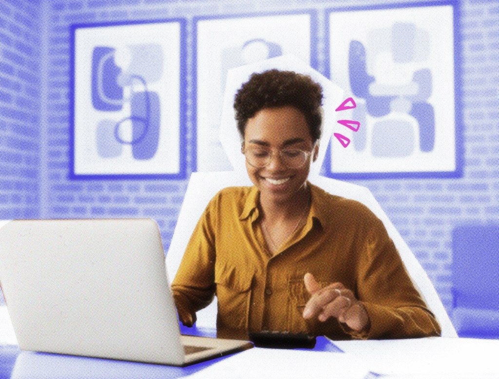 Small business owner working on her taxes at a table with laptop.