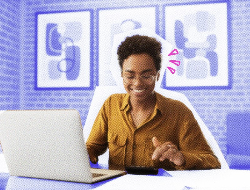 Small business owner working on her taxes at a table with laptop.