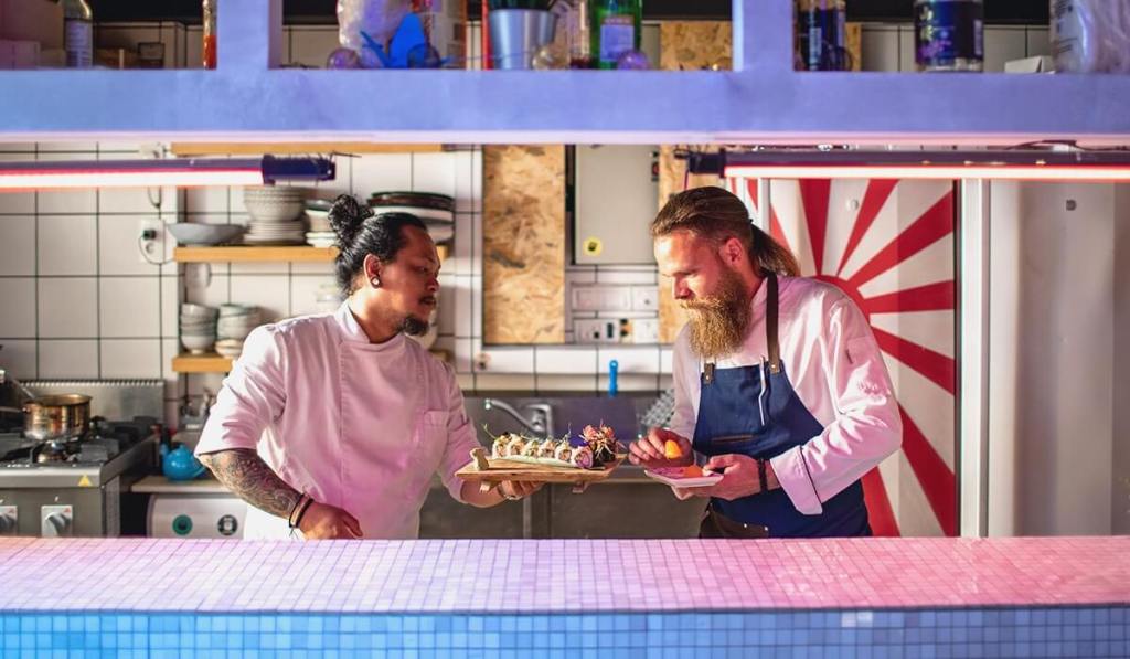 Two business owners who have bop coverage are working in a kitchen