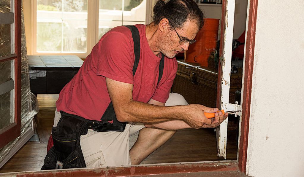 A handyman who owns license and insurance is working on a house project