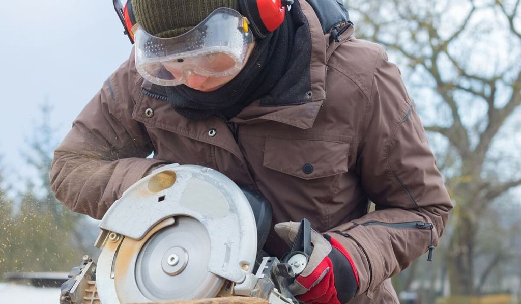 When you get your contractor’s license in North Dakota, you can work at on-site projects, like this contractor wearing safety glasses.
