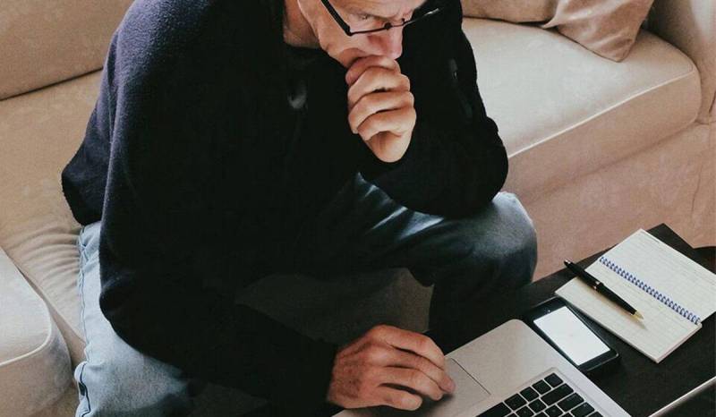 Take time to analyze the best small business accounting software for your needs, like this business owner at his laptop.
