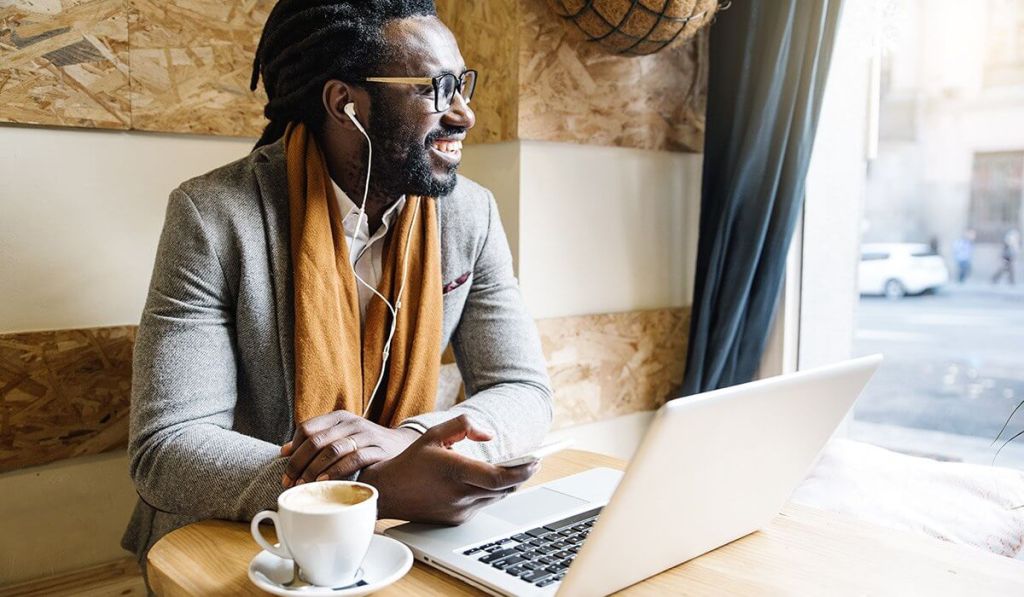 Mindfulness can give you more confidence as a small business owner, like this man at his laptop.